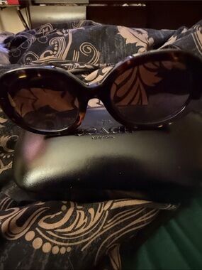Coach Women’s Tortoiseshell Oval Sunglasses with Brown Lenses